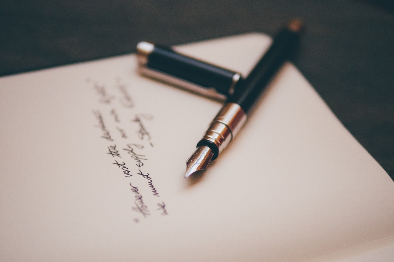 Fountain Pen On A Notebook - Finding A Professional Will Writer in Guildford